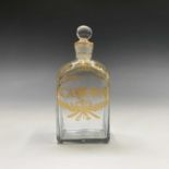 Of American Interest. A small late 18th century clear glass spirit bottle and stopper, gilded with