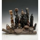 An Akuaba fertility doll, together with a collection of African tribal carvings (box)