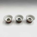 Three Japanese Saki cups, 20th century, each with a magnified image of European naked ladies to