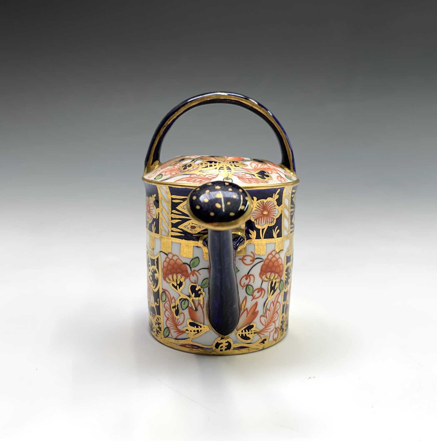 A Royal Crown Derby model of a watering can. Height 7cm. - Image 2 of 3