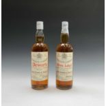 A bottle of John Dewar & Sons White Label finest Scotch Whisky, sealed cap, together with another