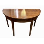 A George III mahogany demi lune side table, with square tapering legs, height 70cm, width 107.5cm,