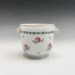 A Richard Ginori cache pot, with twin moulded handles and floral painted decoration. Height 13cm.