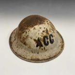 A Second World War ACC helmet.