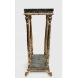 A Continental Gilt and marble two tier lamp stand, with floral moulded gilt supports, on paw feet,