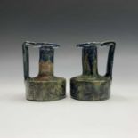 A pair of Belgian art pottery vases, circa 1900, each with angular handle and incised with elephant,