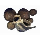 Five assorted cannonballs, the largest diameter 15cm, together with a ship wreck teapot, all