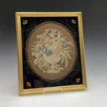 A 19th century embroidered study of a vase of flowers, in verre eglomise and gilt frame. 44.5cm x