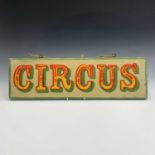 A sign written wooden sign 'CIRCUS'. 19 x 64cm.