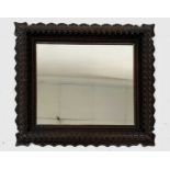 A carved mahogany framed rustic wall mirror, 19th century, 57 x 64cm.