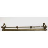 A late Victorian brass fender with tubular top rail. Length 109cm.Condition report: Maximum height