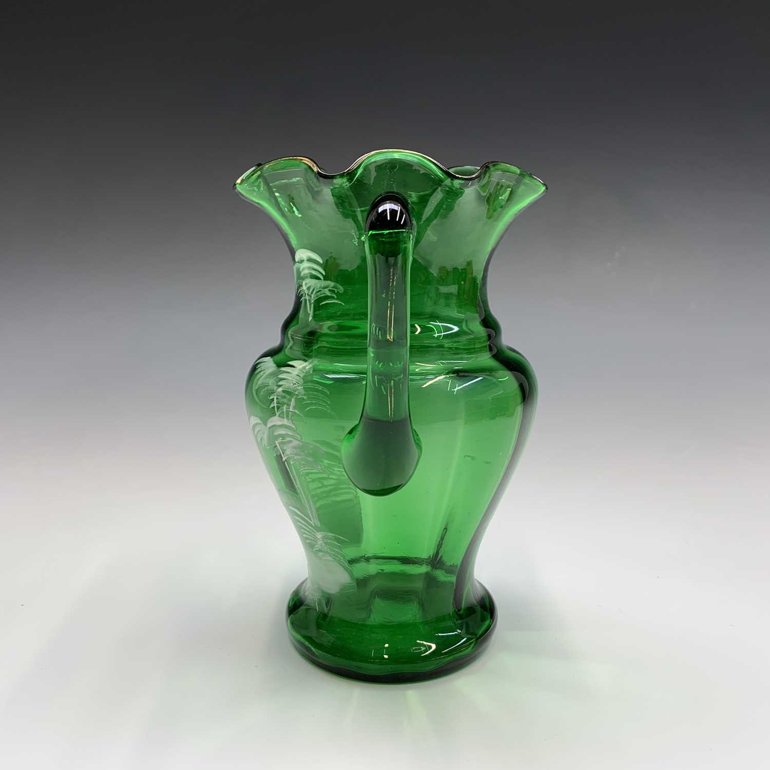 A Mary Gregory green glass jug, late 19th century, enamelled with a figure, height 17cm, together - Image 5 of 20