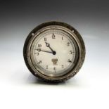 A Smiths motoring dashboard clock, the black painted case retaining original instruction label,