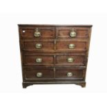 A George III oak chest of drawers, with two short and three long drawers, on bracket feet, height