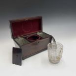 An early Victorian rosewood sarcophagus shape tea caddy, with vacant brass cartouche and
