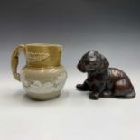 A studio pottery figure of a puppy, indistinctly marked, length 17cm, together with a stoneware