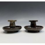 A pair of Cornish serpentine candlesticks, of squat form. Height 7cm.Condition report: Generally