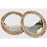 Pair of 19th century oval wall mirrors, the pine frames carved with floral panels and diamond and