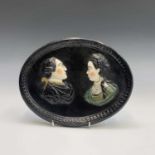 Of American Interest. An oval pearlware plaque, circa 1800, moulded and overpainted with the figures