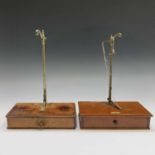 A set of late Victorian brass and mahogany pharmacy scales, the base fitted with a draw containing