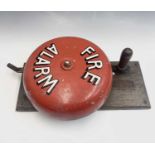 A vintage hand operated 'Fire Alarm' bell on a mahogany mount, height 46cm.