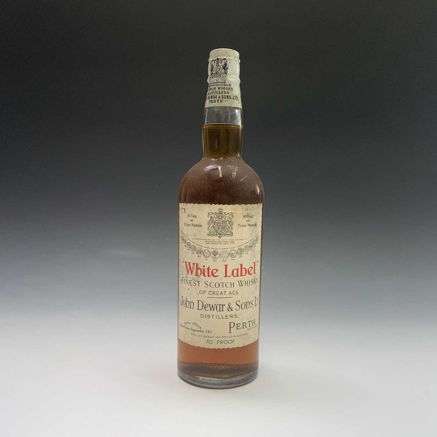 A bottle of John Dewar & Sons White Label finest Scotch Whisky, by appointment to the late King