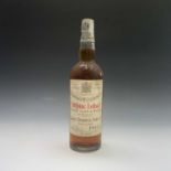 A bottle of John Dewar & Sons White Label finest Scotch Whisky, by appointment to the late King