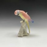 A Karl Ens porcelain model of a budgerigar, printed green mark and impressed numerals to base.