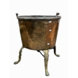 A 19th century copper log bin of large proportions, raised on four bass paw feet. Diameter 62cm,