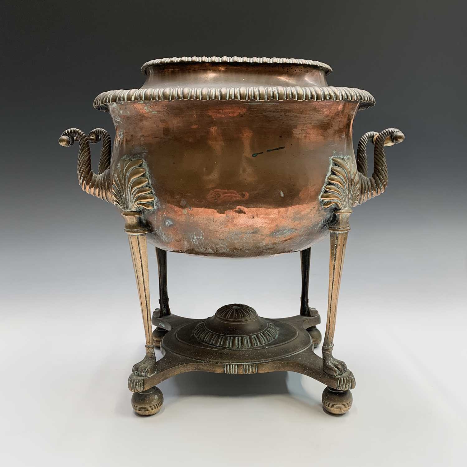 A George III twin handled copper and brass tea urn, the body raised on reeded columns terminating in - Image 4 of 5
