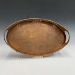 A Herbert Dyer galleried copper tray of oval form, stamped 'H. DYER'. 29cm x 47.5cm.