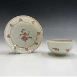 A late 18th century Lowestoft porcelain tea bowl and saucer with polychrome enamel decoration.