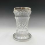 A cut glass vase with hallmarked silver rim. Height 20cm.