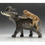 A large Beswick model of a tiger attacking an elephant, model number 1720, printed marks. Height