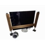 A Bang & Olufsen Beo Vision Eclipse 65" television, with a pair of matching freestanding speakers,