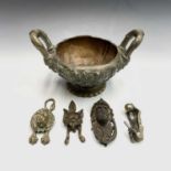 A 19th century heavy brass bowl, with twin handles and deep relief foliate cast decoration on a