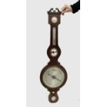 A Victorian rosewood wheel barometer with broken arch pediment and silvered dials. Overall height