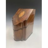 A George III mahogany and inlaid knife box of Sheraton design, the slope front with oval paterae