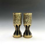 WWI Trench Art. A pair of vases fashioned from brass shell cases, the upper sections repousse