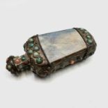An Asian white metal mounted snuff bottle, set with turquoise and coral coloured stones, height
