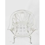 A white painted wrought iron garden or conservatory chair with scroll decoration. Height 77cm.