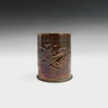 A Newlyn copper tea caddy of cylindrical form, the body decorated with two fish, the lid with