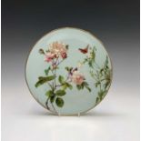 A Mintons china plate, painted by R Pilsbury with a butterfly amidst dog roses on a pale blue