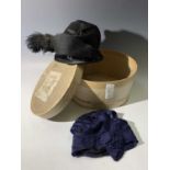 Two 1920s hats, one dark blue cloche style (needing repair), the other black silk with velvet