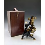 A microscope, by W Watson & Sons, High Holborn, London with brass and black lacquered finish, cased,