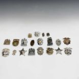 A group of 18 Police and Sheriff badges, mainly American, some with enamel decoration and