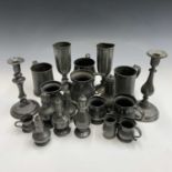 18th and 19th century pewter, to include a barrel form jug, height 12cm, nine mugs or measures,