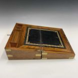 A Victorian walnut and brass bound writing slope, with gilt tooled leather writing surface and