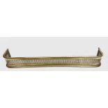 A 19th century pierced brass fender. Overall width 99cm, overall depth 16cm.Condition report: No