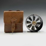 An anemometer by Negretti and Zambra, with brass and black lacquered finish, leather cased, diameter